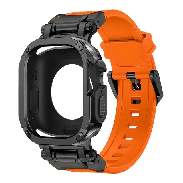 orange apple watch band and black case, laid down on a black table next to air pods and a black notebook