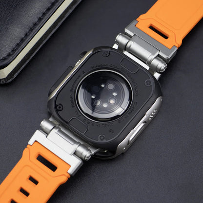 apple watch band with orange strap, showing the back casing made if rubber on a black table