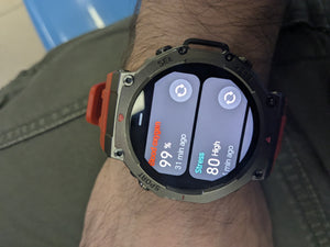 Smartwatch on a wrist displaying health metrics with a blurred background